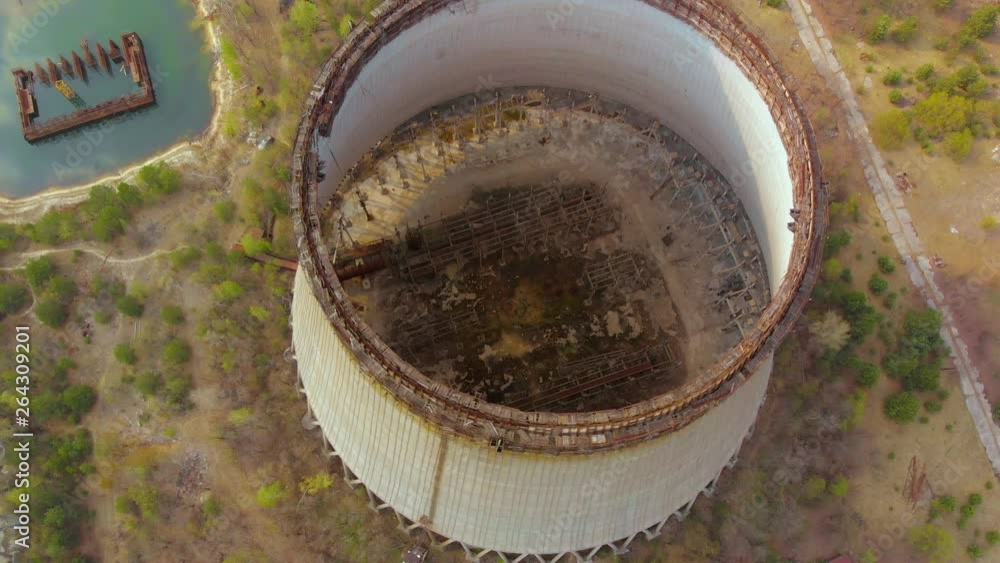 Drone flies over the cooling tower, Chernobyl NPP. Investigation of the cooling tower state. Flying over the cooling tower near the Chernobyl nuclear power plant. Massive construction of concrete. Drone flies over the cooling tower, Chernobyl NPP. Investigation of the cooling tower state. Flying over the cooling tower near the Chernobyl nuclear power plant. Massive construction of concrete.