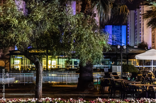 a night shoot from a cafe at midnight - good looking cityscape as background © Swonie