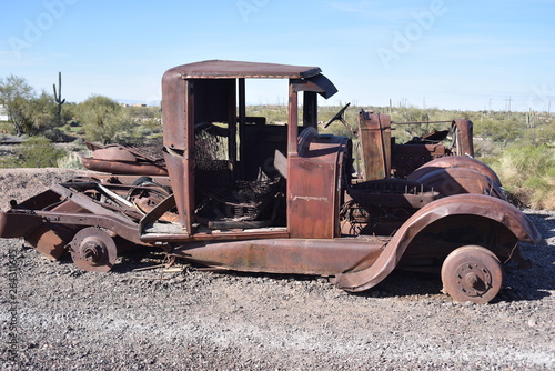 Abandoned, rusted-out vintage automobiles and trucks.