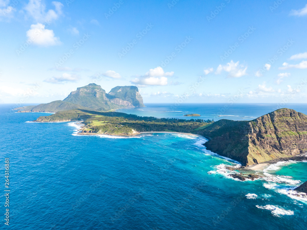 Stunning aerial panorama drone view of Lord Howe Island, an Australian pacific subtropical island in the Tasman Sea between Australia and New Zealand. Famous Ned's Beach in the foreground.