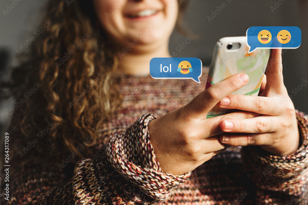 Teen using emojis - obrazy, fototapety, plakaty 