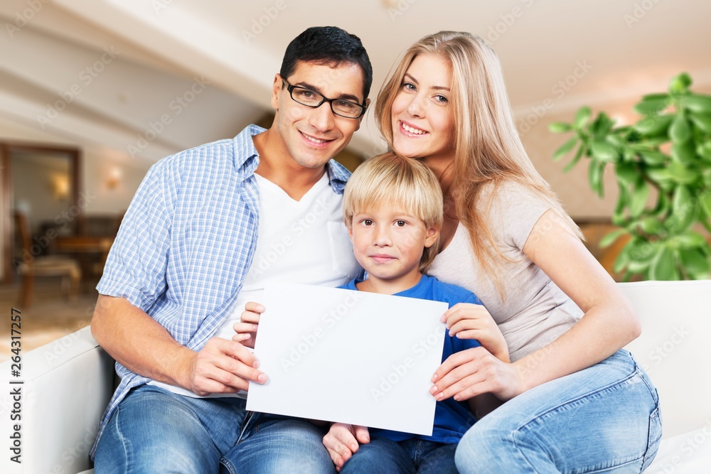 Young family at home smiling at camera Young family at home smiling at camera