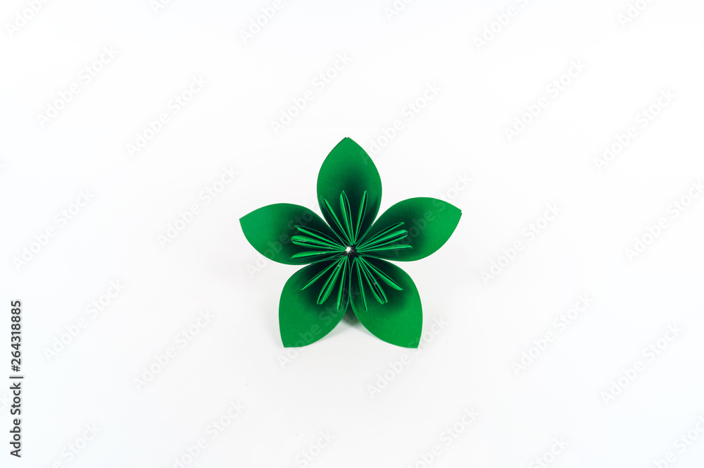Origami kusudama green flower stands in a row against a white background. Rainbow color.