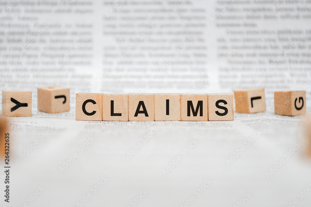 Claims Word Written In Wooden Cube - Newspaper