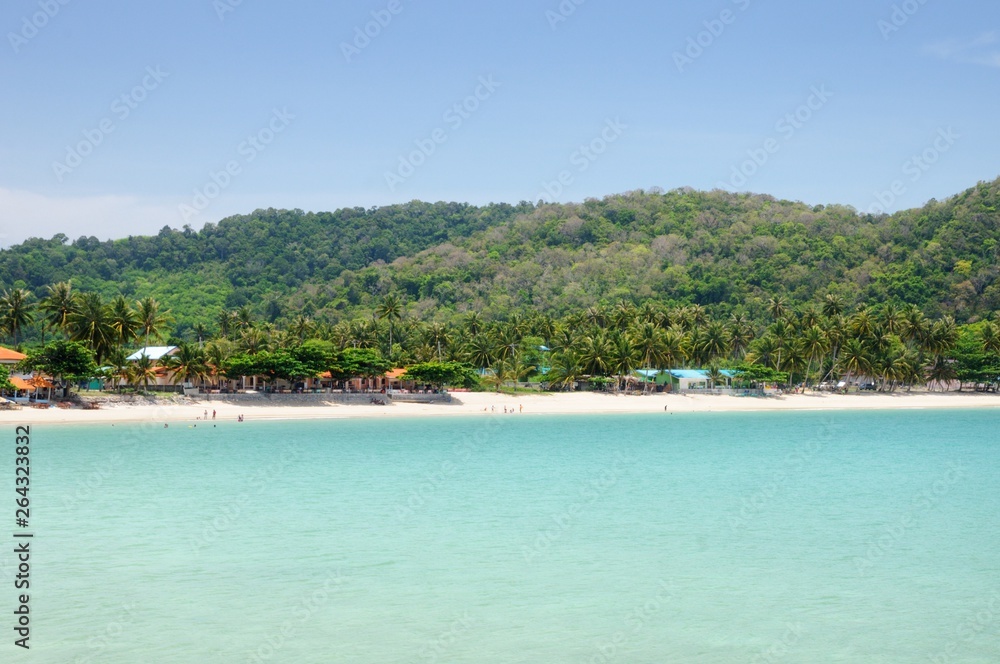 Tropical turquoise sea bay, paradise sandy beach, palm trees, tourist resorts, Haad Kwang Pao Beach in Khanom district of Nakhon Si Thammarat province of Thailand.