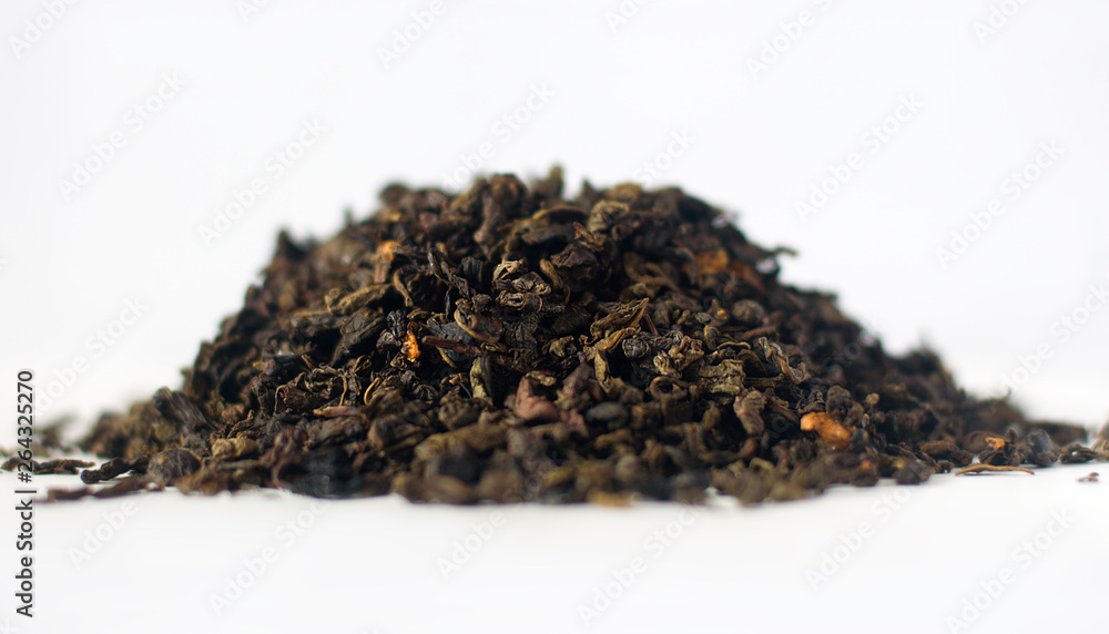 Dry tea leaves. White background. Selective focus. Dry tea leaves. White background. Selective focus.