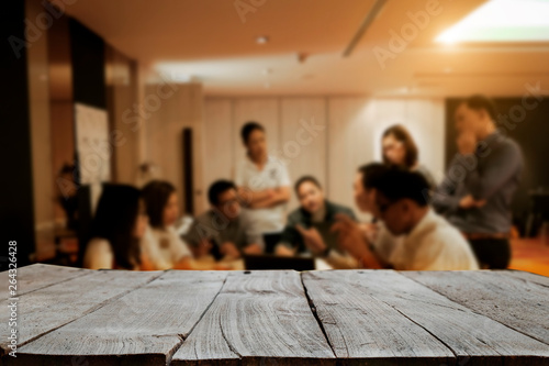 Desk wood space platform with business people in a meeting at office in morning lightFor product display montage. photo