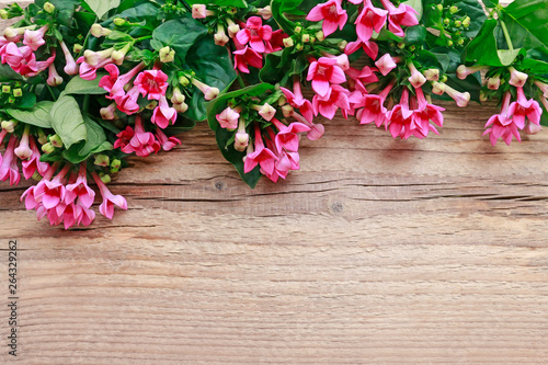 Fototapeta Naklejka Na Ścianę i Meble -  Bouquet of pink flowers on wooden table
