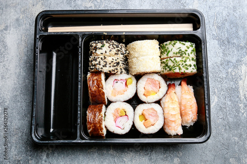 Sushi set on grey stone background.