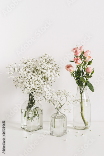 Romantic wedding flowers arrangement on table wall background