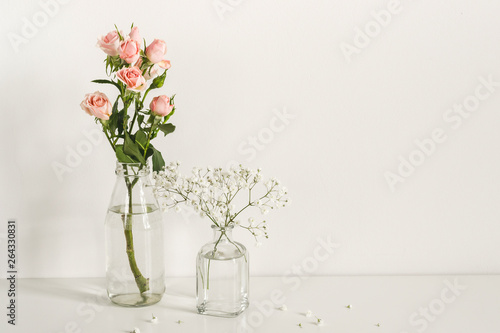Romantic elegant minimalistic composition with roses and gypsophila flowers. mockup