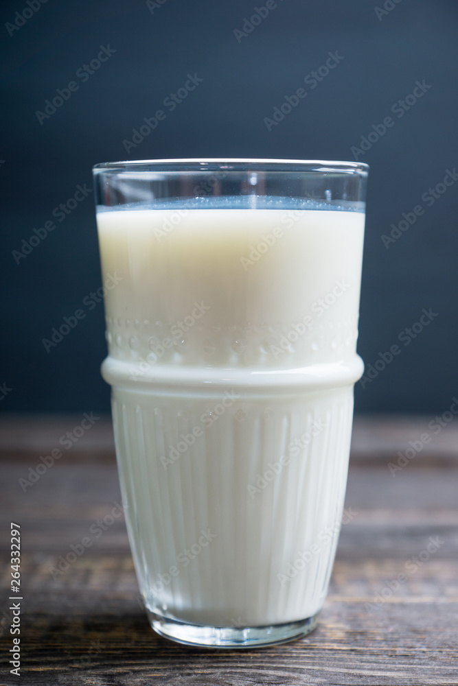 Glass of cold milk on the rustic background. Selective focus. Shallow depth of field. Glass of cold milk on the rustic background. Selective focus. Shallow depth of field.