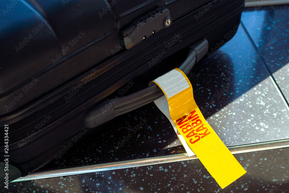 .The yellow tag is not luggage, giving permission to take the luggage