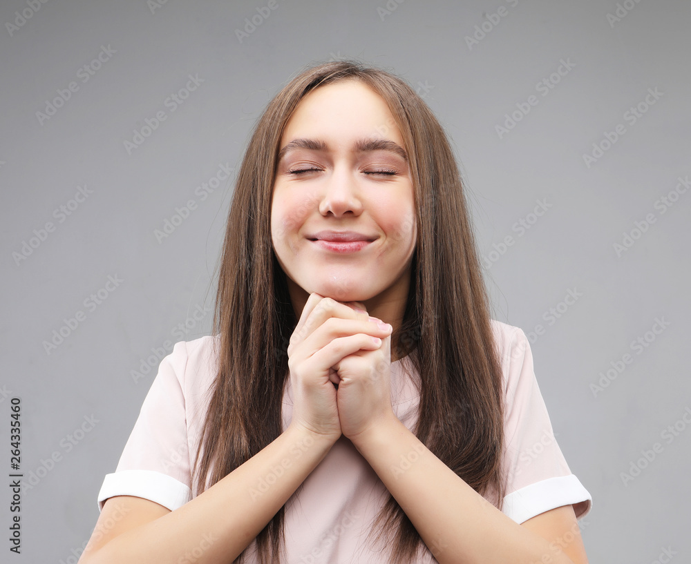 Superstitious teenager girl hoping her wishes will come true, having excited happy look Superstitious teenager girl hoping her wishes will come true, having excited happy look