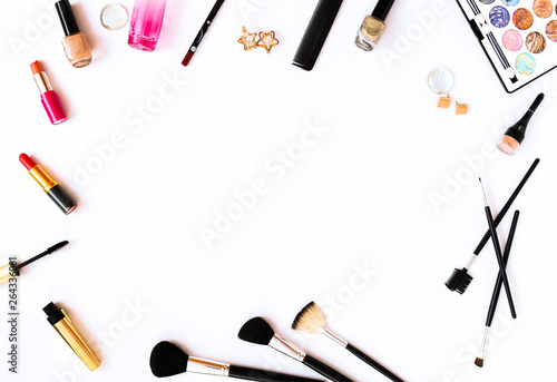 Professional decorative cosmetics and makeup brushes on white background. Flat lay. Top view.