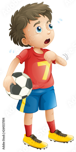 Boy playing soccer football looking tired