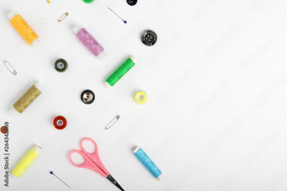 White background with different tools for sewing and tailoring White background with different tools for sewing and tailoring