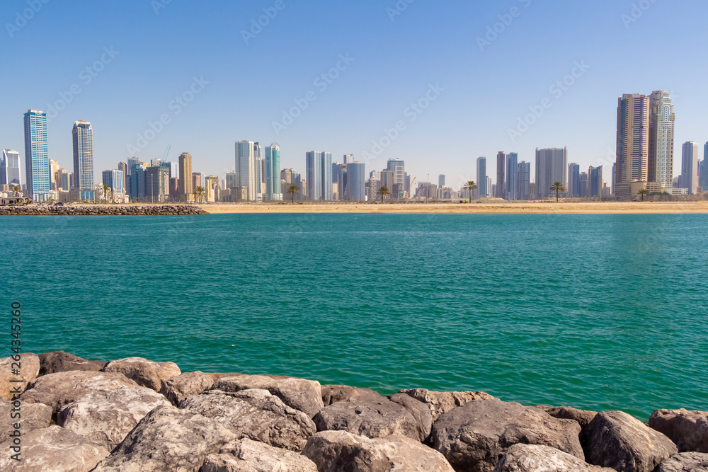 Fototapeta premium Modern city on the shores of the azure sea.