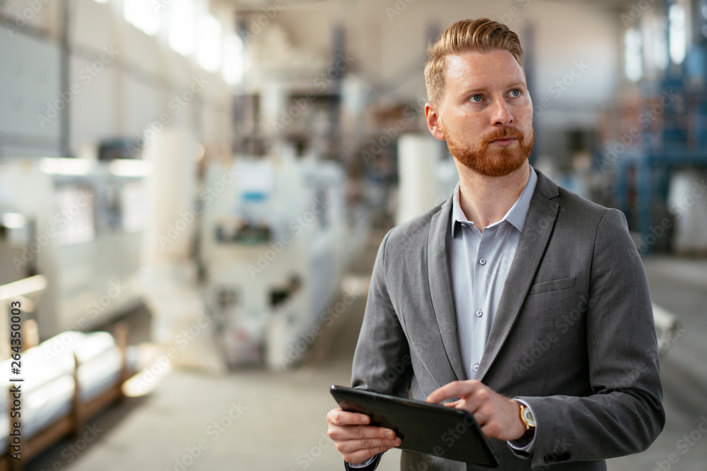 Factory supervisor on duty. Inspector comes to a factory Manager at a factory. Boss checking the warehouse during the day Factory supervisor on duty. Inspector comes to a factory Manager at a factory. Boss checking the warehouse during the day