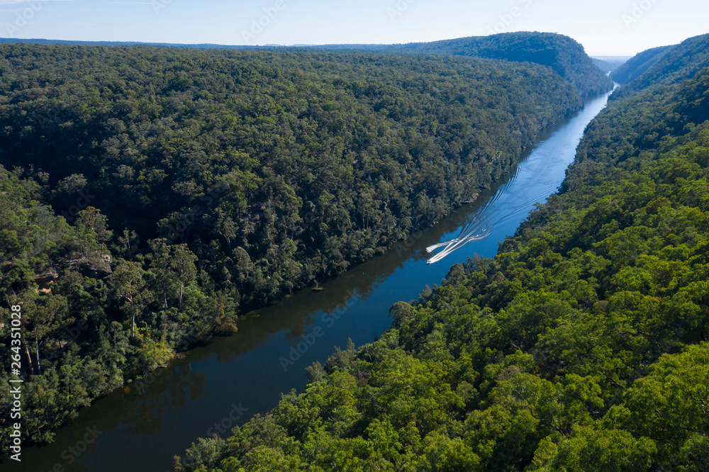 Water Skiing on the Nepean River flowing through Fairlight Gorge in New South Wales, Australia.