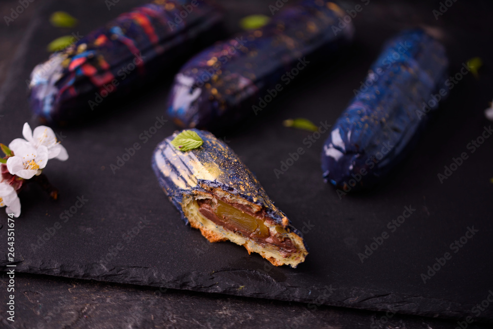 Beautiful and tasty dessert on a slate board with petals. Beautiful and tasty dessert on a slate board with petals.