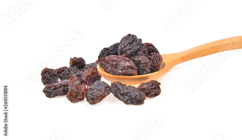 Black raisins on white background