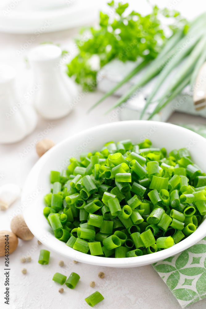 Fresh green onion sliced in bowl Fresh green onion sliced in bowl