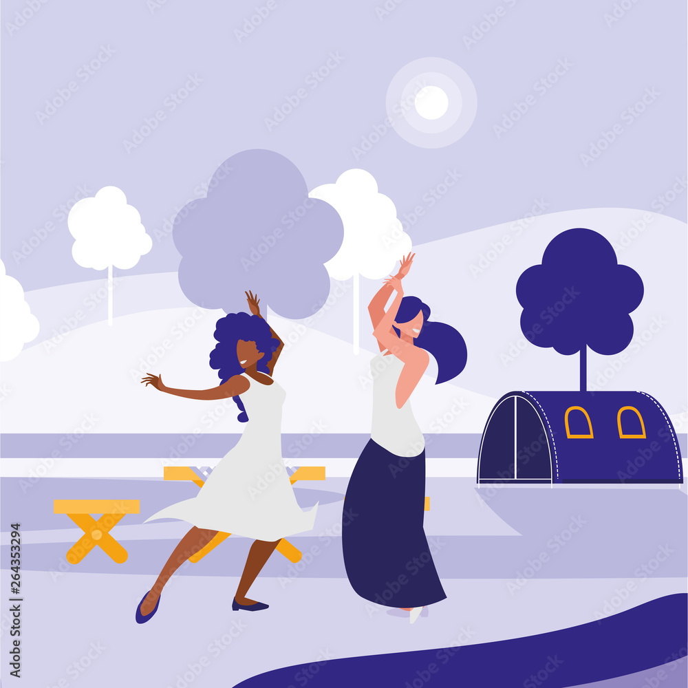 young interracial girls dancing in the park