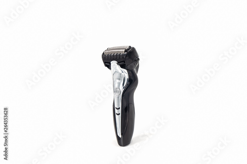 Electric shaver on white background.