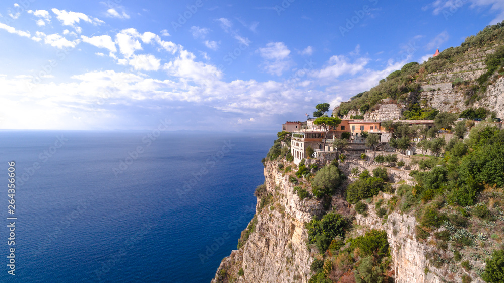 hotel in Paradise, beautiful panoramic view on the rocky bay at sunny day, travel to Europe, vacation travel tour, mountains hotel, building, architecture. copy space