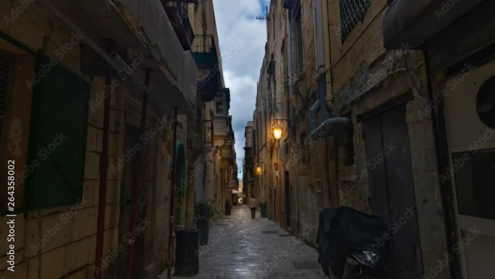 Time lapse view of a typical narrow lane in Valletta (Malta) before sunset Time lapse view of a typical narrow lane in Valletta (Malta) before sunset