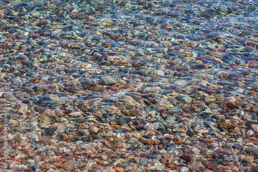 seamless background wet stones beach  surface near water 