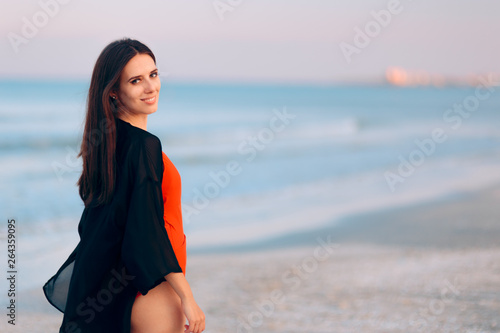 Portrait of a Beautiful Woman Walking on the Beach