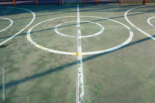 colorful basketball court in the street in Bilbao city, lines and markings on the ground © Ismael