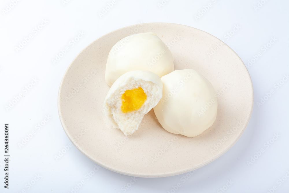 A dish of white bread is placed on a white background. A dish of white bread is placed on a white background.