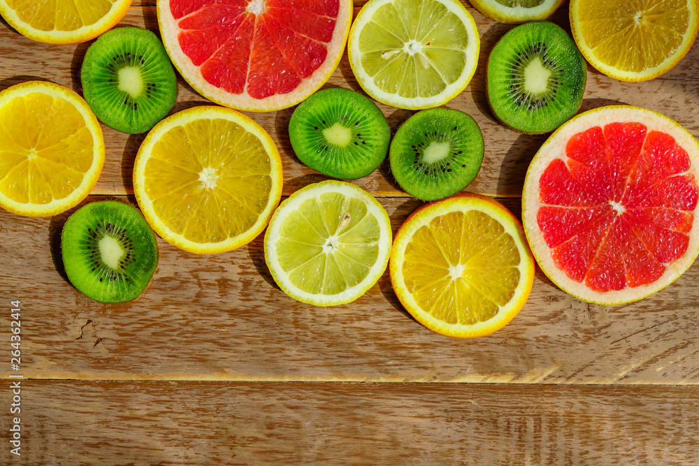 frame with slice of oranges, lemons, kiwi, grapefruit pattern isolated on white background. Copy space frame with slice of oranges, lemons, kiwi, grapefruit pattern isolated on white background. Copy space