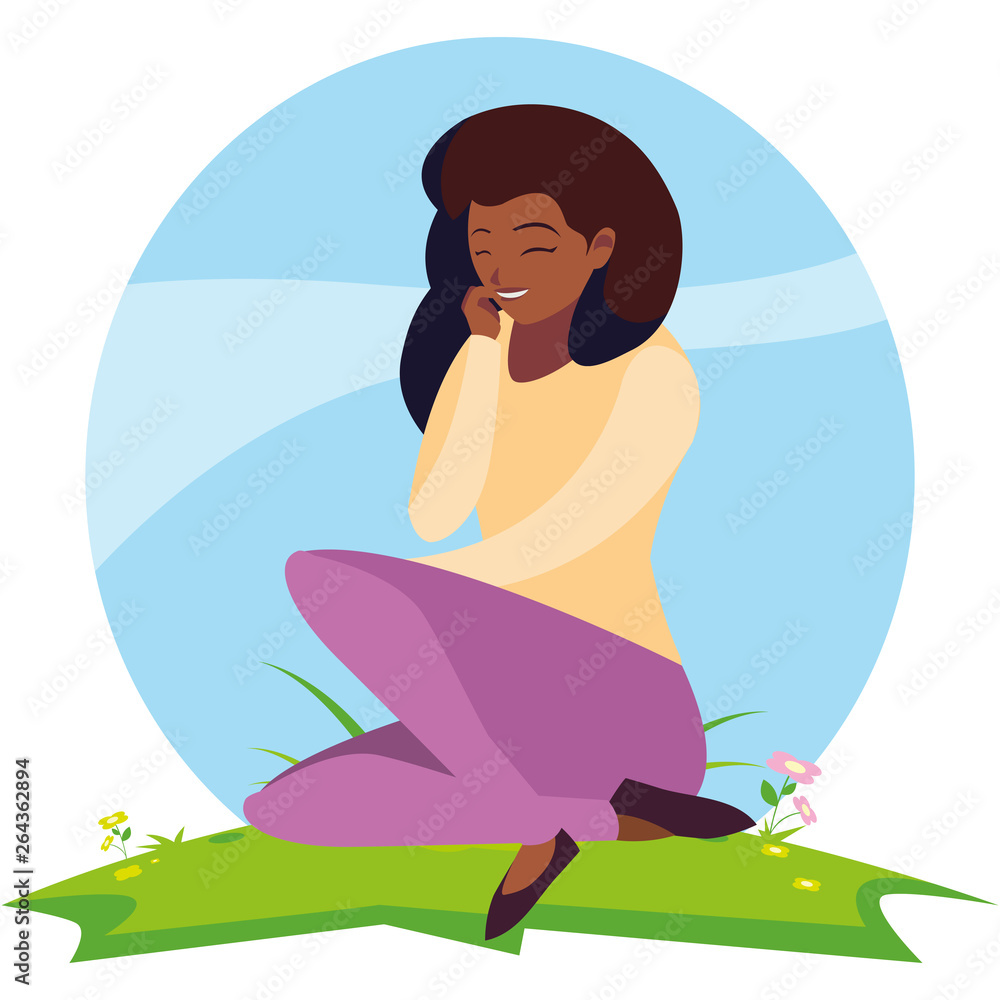 beautiful black woman seated in the park