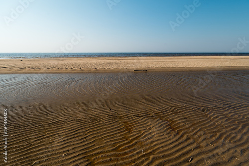 Dessert like textured sand - Baltic sea gulf beach with white sand in the sunset
