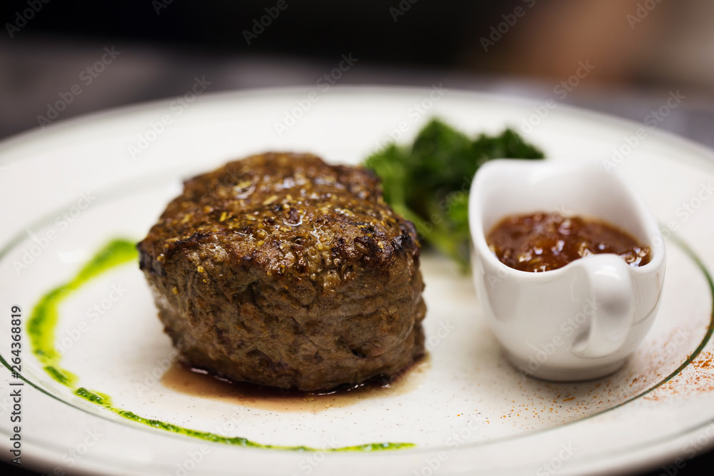 Beef steak with spices and sauce. Restaurant dish. Meat. Meaidum rare. Beef steak with spices and sauce. Restaurant dish. Meat. Meaidum rare.
