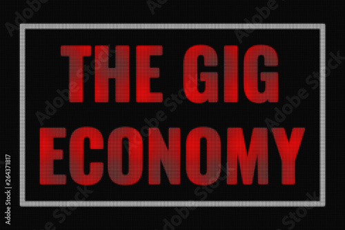 The Gig economy word on dark screen