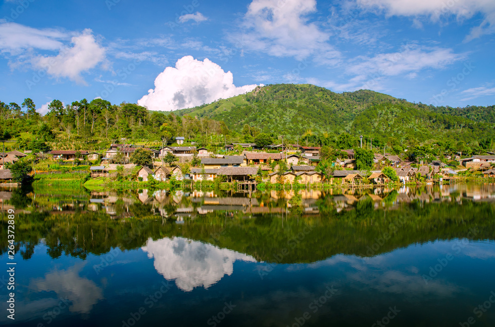 beautiful lake and sky view of village and mountain reflection
