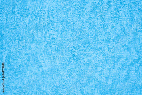 Bright blue stucco texture. Background.