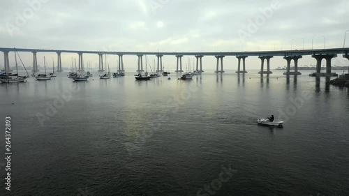 Wallpaper Mural Aerial Lockdown: Boats Floating In Ocean Water Under Bridge On Cloudy Day in San Diego, United States of America Torontodigital.ca