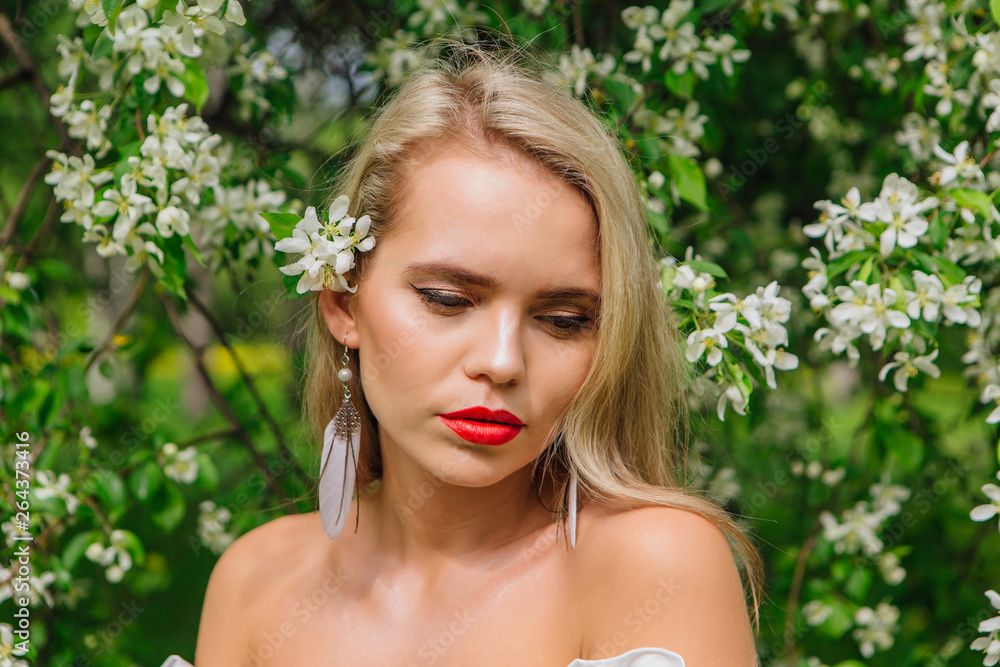 Sexy modern bride enjoing blooming apple tree flowers. Sexy modern bride enjoing blooming apple tree flowers.