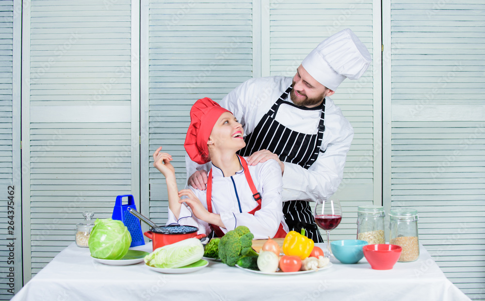 Couple compete in culinary arts. Reasons why couples cooking together. Cooking with your spouse can strengthen relationships. Woman and bearded man culinary partners. Ultimate cooking challenge Couple compete in culinary arts. Reasons why couples cooking together. Cooking with your spouse can strengthen relationships. Woman and bearded man culinary partners. Ultimate cooking challenge