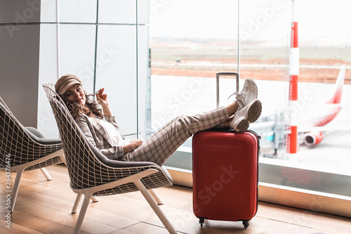 Young beautiful woman in Airport waiting room. photo