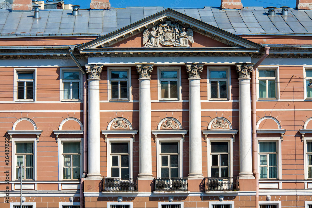 Fototapeta premium The facade of a residential building built in the 19th century on the Fontanka river. Saint-Petersburg
