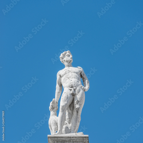 Statue as roof decoration of Doge's Palace in Venice, Italy