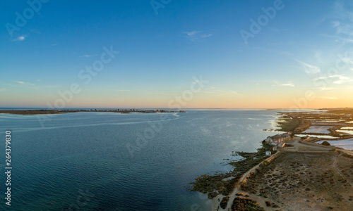 Algarve sunset seascape at Ria Formosa wetlands reserve, southern Portugal.