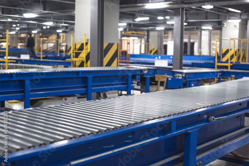 Factory roller conveyor system for transporting crates photo